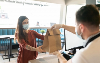 Picture of a person getting takeout from Newport, Oregon, restaurant.