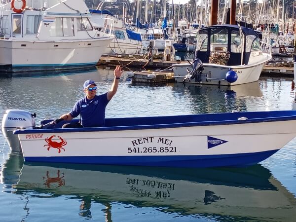 A man on the water in Newport, Oregon, utilizing boat rentals.