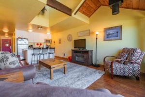 The living space of a Newport resort room to unwind in after going whale watching.