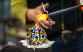 Someone trying glass blowing at a shop in Newport, Oregon.