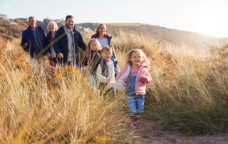 A family hiking during their Oregon reunion vacation to Newport.