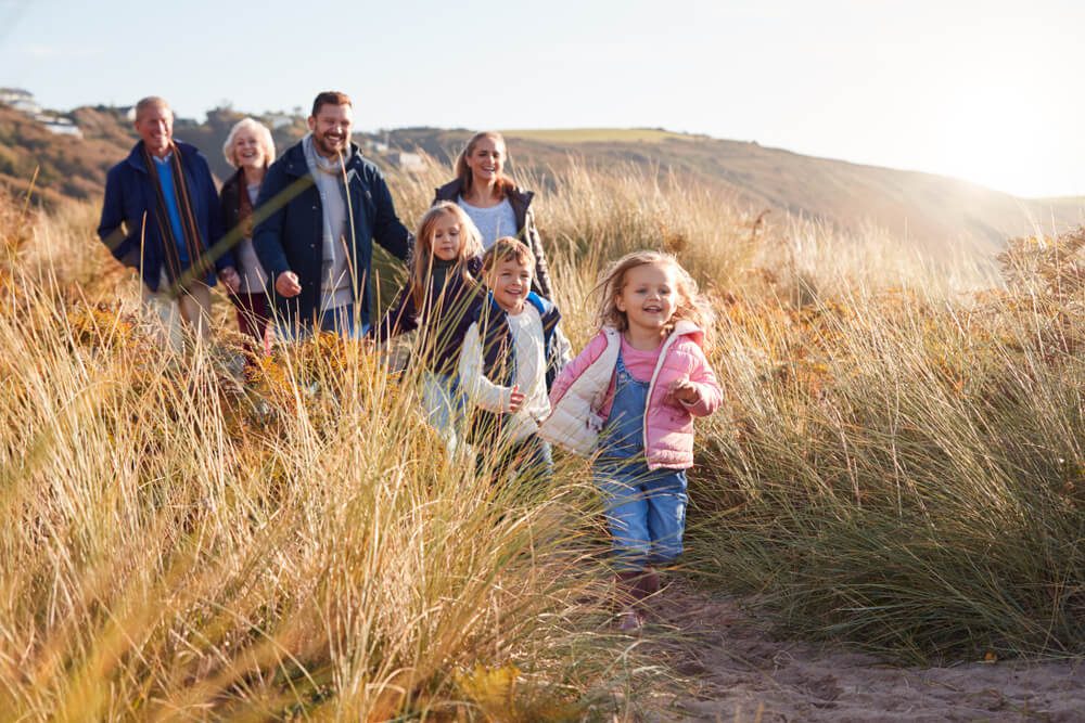 A family hiking during their Oregon reunion vacation to Newport.