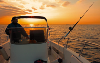 A person out fishing with one of the best Newport charters.