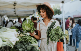 A woman shopping at an Oregon farmers market in Newport.