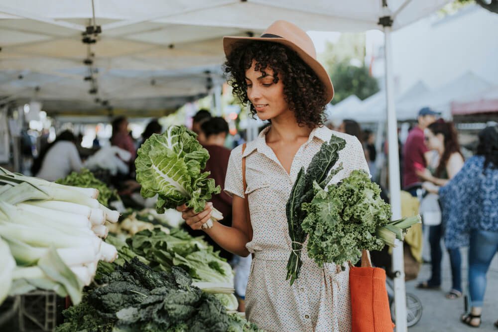 A woman shopping at an Oregon farmers market in Newport.