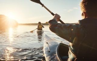 Two people out on kayak rentals in Newport, Oregon.