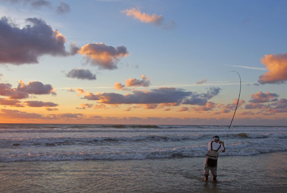 A man surf fishing on the Oregon coast near Newport.