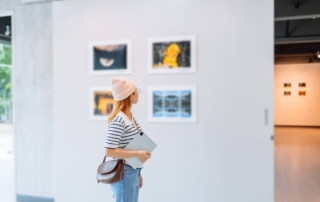 A woman exploring a Newport art gallery.