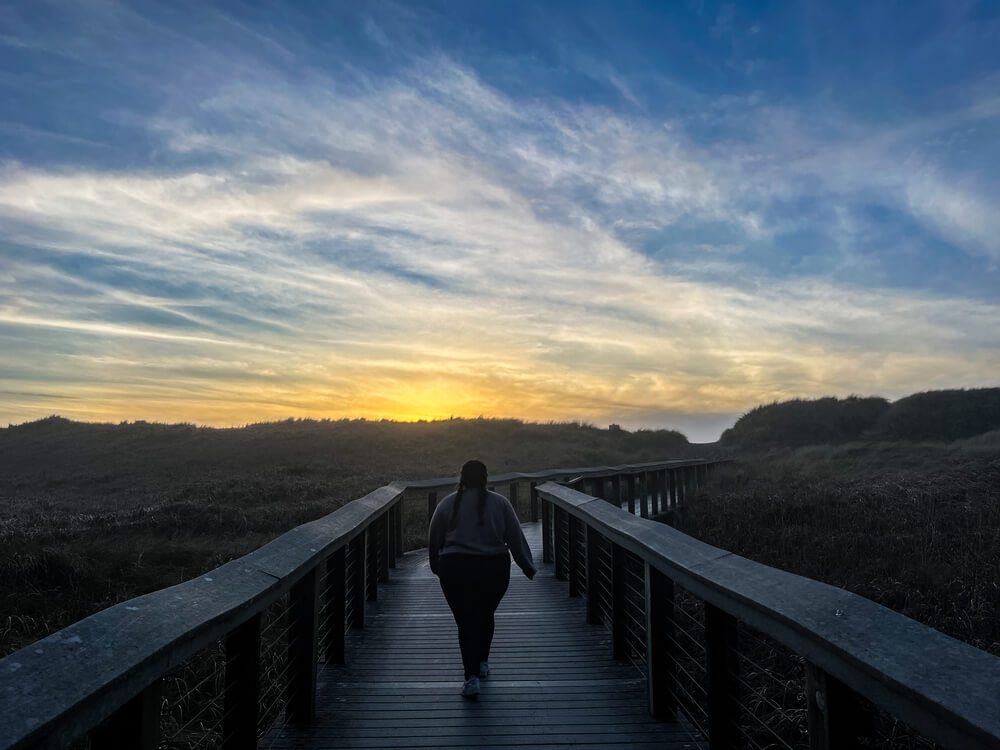 A person hiking in Newport in the winter.